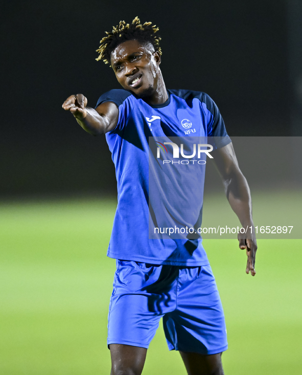 Kyrgyzstan team player Kojo Joel participates in the training session at Qatar University training pitch in Doha, Qatar, on October 9, 2024,...