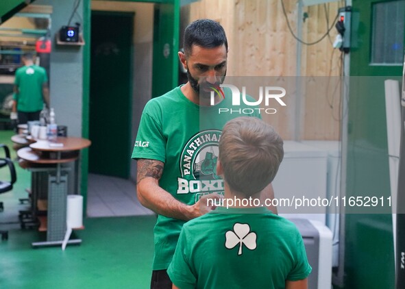 Second coach Giannis Manolis of Panathinaikos Boxing Club teaches youngsters in Athens, Greece, on October 9, 2024. 