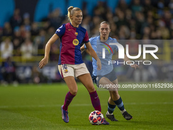 Fridolina Rolfo #16 of FC Barcelona is in possession of the ball during the UEFA Women's Champions League Group D match between Manchester C...