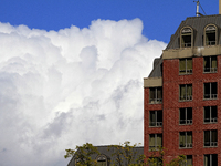 A large rain cloud passes by an apartment building in downtown Brampton, Ontario, Canada, on October 9, 2024. (