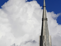 A large rain cloud passes by the spire of Grace United Church on Main Street in downtown Brampton, Ontario, Canada, on October 9, 2024. (