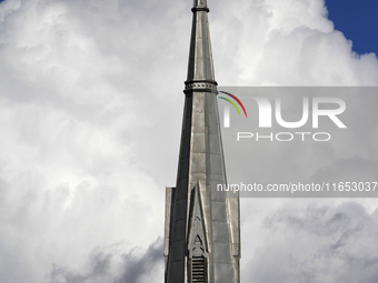 A large rain cloud passes by the spire of Grace United Church on Main Street in downtown Brampton, Ontario, Canada, on October 9, 2024. (