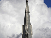 A large rain cloud passes by the spire of Grace United Church on Main Street in downtown Brampton, Ontario, Canada, on October 9, 2024. (