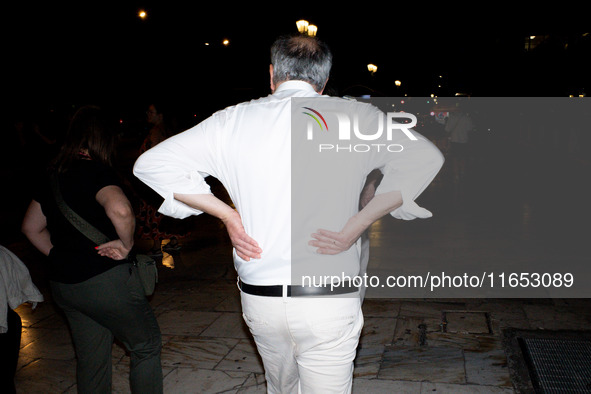 Tourists and locals spend their time at night in the center in Athens, Greece, on October 9, 2024. 