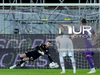 David De Gea of ACF Fiorentina saves on penalty kicked by Theo Hernandez of AC Milan during the Serie A Enilive match between ACF Fiorentina...