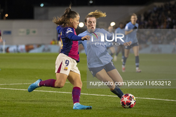 Lauren Hemp #11 of Manchester City W.F.C. tackles Claudia Pina #9 of FC Barcelona during the UEFA Women's Champions League Group D match bet...