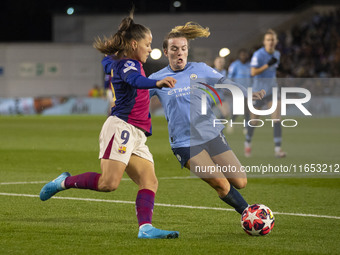 Lauren Hemp #11 of Manchester City W.F.C. tackles Claudia Pina #9 of FC Barcelona during the UEFA Women's Champions League Group D match bet...