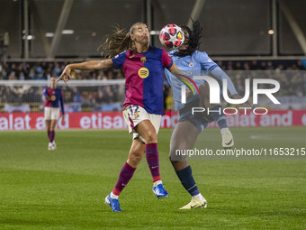 Patricia Guijarro #12 of FC Barcelona is tackled by Khadija Shaw #21 of Manchester City W.F.C. during the UEFA Women's Champions League Grou...