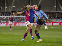 Patricia Guijarro #12 of FC Barcelona is tackled by Khadija Shaw #21 of Manchester City W.F.C. during the UEFA Women's Champions League Grou...