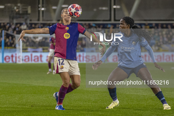 Patricia Guijarro #12 of FC Barcelona is tackled by Khadija Shaw #21 of Manchester City W.F.C. during the UEFA Women's Champions League Grou...