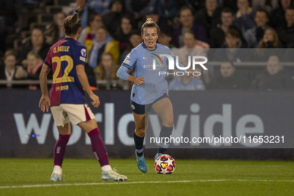 Lauren Hemp #11 of Manchester City W.F.C. is tackled by Ona Batlle #22 of FC Barcelona during the UEFA Women's Champions League Group D matc...