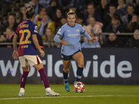 Lauren Hemp #11 of Manchester City W.F.C. is tackled by Ona Batlle #22 of FC Barcelona during the UEFA Women's Champions League Group D matc...