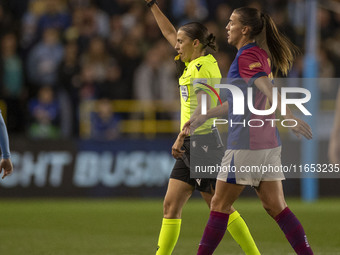 Referee Stephanie Frappart shows a yellow card to Laia Aleixandri #4 of Manchester City W.F.C. during the UEFA Women's Champions League Grou...