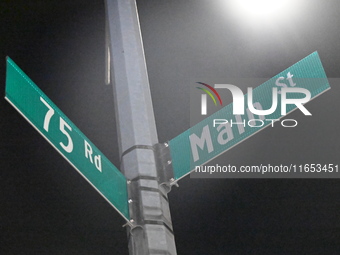 Street signage marks the location of the assault. Detectives investigate the scene and search the area in the evening hours following a hate...