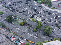 An aerial photo taken in Dujiangyan, China, on October 9, 2024, shows the ancient city complex of Guxian County in Dujiangyan City, Sichuan...