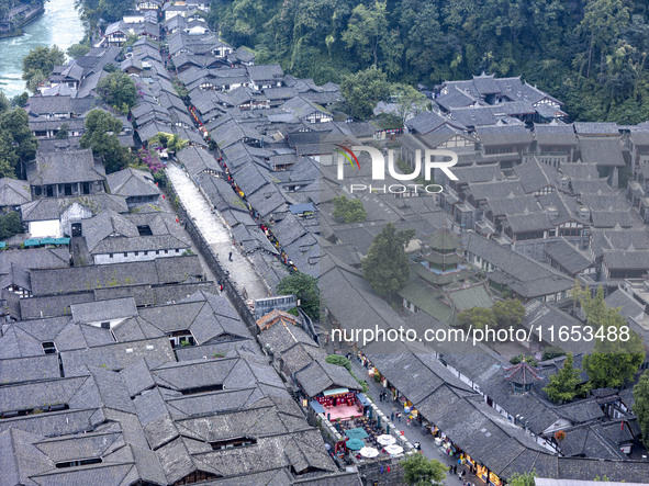 An aerial photo taken in Dujiangyan, China, on October 9, 2024, shows the ancient city complex of Guxian County in Dujiangyan City, Sichuan...