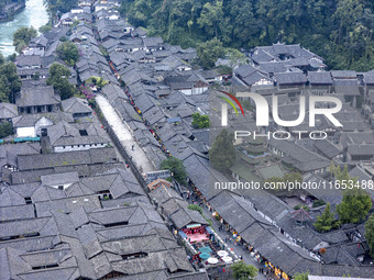 An aerial photo taken in Dujiangyan, China, on October 9, 2024, shows the ancient city complex of Guxian County in Dujiangyan City, Sichuan...