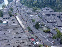 An aerial photo taken in Dujiangyan, China, on October 9, 2024, shows the ancient city complex of Guxian County in Dujiangyan City, Sichuan...