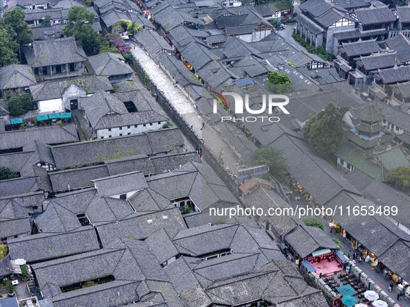 An aerial photo taken in Dujiangyan, China, on October 9, 2024, shows the ancient city complex of Guxian County in Dujiangyan City, Sichuan...