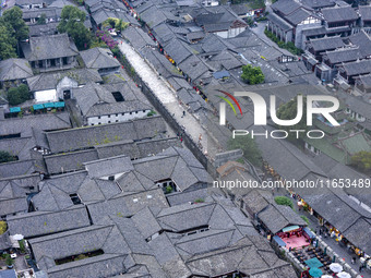 An aerial photo taken in Dujiangyan, China, on October 9, 2024, shows the ancient city complex of Guxian County in Dujiangyan City, Sichuan...