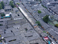 An aerial photo taken in Dujiangyan, China, on October 9, 2024, shows the ancient city complex of Guxian County in Dujiangyan City, Sichuan...