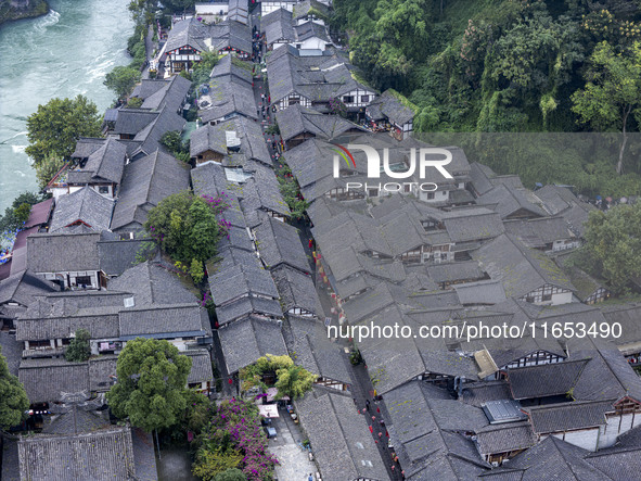 An aerial photo taken in Dujiangyan, China, on October 9, 2024, shows the ancient city complex of Guxian County in Dujiangyan City, Sichuan...