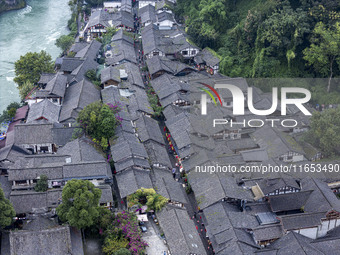 An aerial photo taken in Dujiangyan, China, on October 9, 2024, shows the ancient city complex of Guxian County in Dujiangyan City, Sichuan...