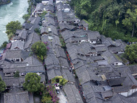 An aerial photo taken in Dujiangyan, China, on October 9, 2024, shows the ancient city complex of Guxian County in Dujiangyan City, Sichuan...