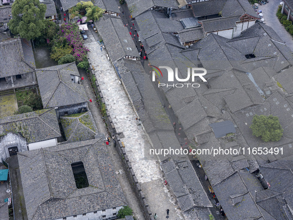 An aerial photo taken in Dujiangyan, China, on October 9, 2024, shows the ancient city complex of Guxian County in Dujiangyan City, Sichuan...