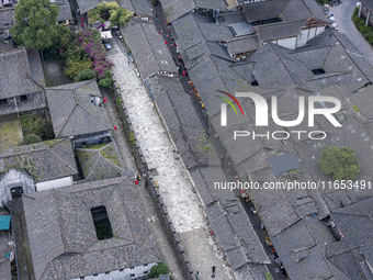 An aerial photo taken in Dujiangyan, China, on October 9, 2024, shows the ancient city complex of Guxian County in Dujiangyan City, Sichuan...