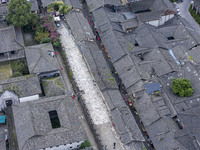 An aerial photo taken in Dujiangyan, China, on October 9, 2024, shows the ancient city complex of Guxian County in Dujiangyan City, Sichuan...