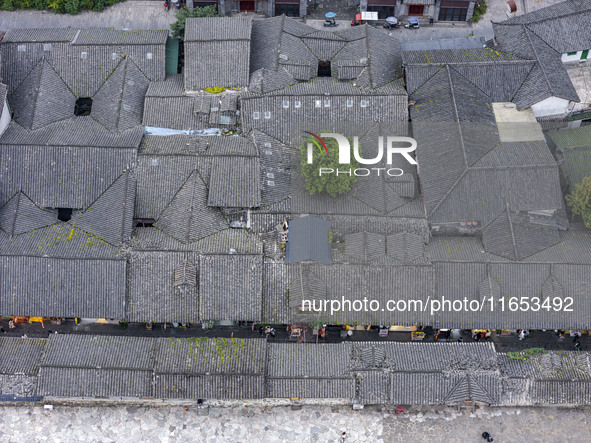 An aerial photo taken in Dujiangyan, China, on October 9, 2024, shows the ancient city complex of Guxian County in Dujiangyan City, Sichuan...