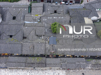 An aerial photo taken in Dujiangyan, China, on October 9, 2024, shows the ancient city complex of Guxian County in Dujiangyan City, Sichuan...