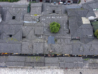 An aerial photo taken in Dujiangyan, China, on October 9, 2024, shows the ancient city complex of Guxian County in Dujiangyan City, Sichuan...