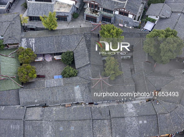 An aerial photo taken in Dujiangyan, China, on October 9, 2024, shows the ancient city complex of Guxian County in Dujiangyan City, Sichuan...