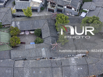 An aerial photo taken in Dujiangyan, China, on October 9, 2024, shows the ancient city complex of Guxian County in Dujiangyan City, Sichuan...