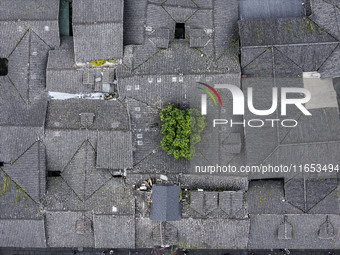 An aerial photo taken in Dujiangyan, China, on October 9, 2024, shows the ancient city complex of Guxian County in Dujiangyan City, Sichuan...