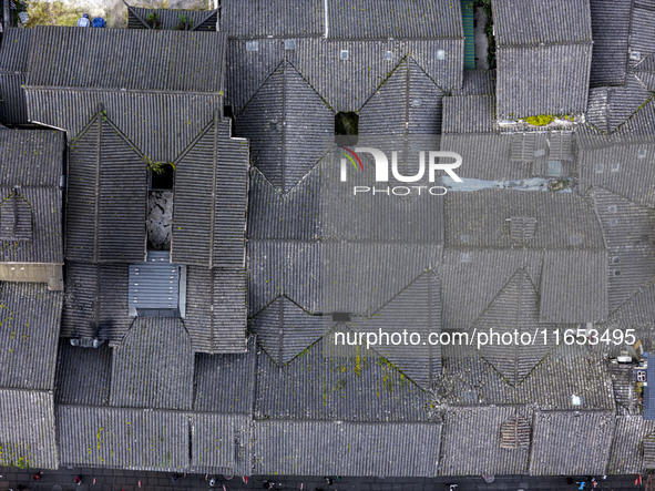 An aerial photo taken in Dujiangyan, China, on October 9, 2024, shows the ancient city complex of Guxian County in Dujiangyan City, Sichuan...