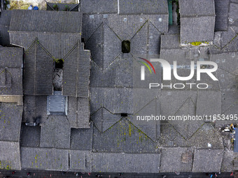 An aerial photo taken in Dujiangyan, China, on October 9, 2024, shows the ancient city complex of Guxian County in Dujiangyan City, Sichuan...