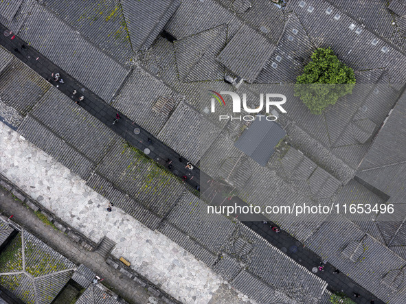 An aerial photo taken in Dujiangyan, China, on October 9, 2024, shows the ancient city complex of Guxian County in Dujiangyan City, Sichuan...