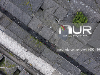 An aerial photo taken in Dujiangyan, China, on October 9, 2024, shows the ancient city complex of Guxian County in Dujiangyan City, Sichuan...