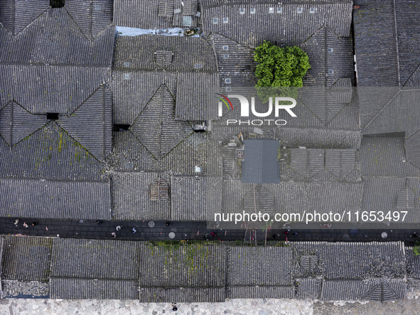 An aerial photo taken in Dujiangyan, China, on October 9, 2024, shows the ancient city complex of Guxian County in Dujiangyan City, Sichuan...