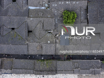 An aerial photo taken in Dujiangyan, China, on October 9, 2024, shows the ancient city complex of Guxian County in Dujiangyan City, Sichuan...