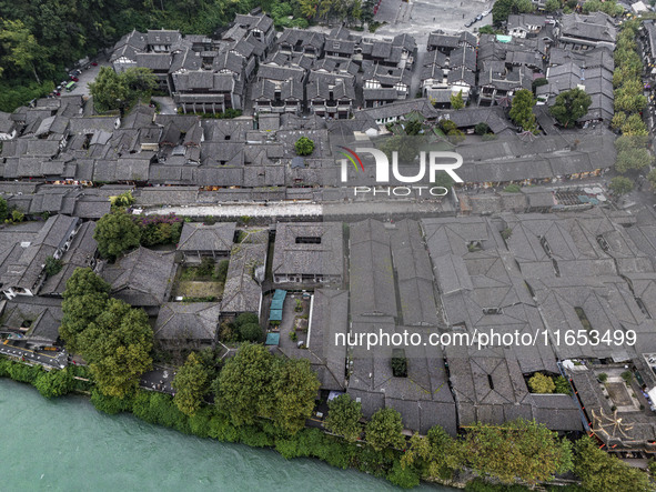 An aerial photo taken in Dujiangyan, China, on October 9, 2024, shows the ancient city complex of Guxian County in Dujiangyan City, Sichuan...