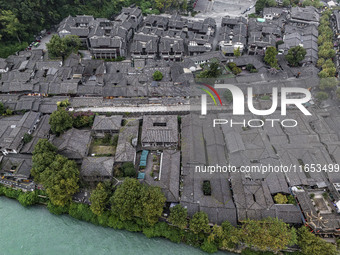 An aerial photo taken in Dujiangyan, China, on October 9, 2024, shows the ancient city complex of Guxian County in Dujiangyan City, Sichuan...