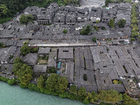 An aerial photo taken in Dujiangyan, China, on October 9, 2024, shows the ancient city complex of Guxian County in Dujiangyan City, Sichuan...