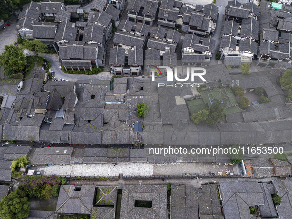 An aerial photo taken in Dujiangyan, China, on October 9, 2024, shows the ancient city complex of Guxian County in Dujiangyan City, Sichuan...