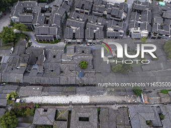 An aerial photo taken in Dujiangyan, China, on October 9, 2024, shows the ancient city complex of Guxian County in Dujiangyan City, Sichuan...