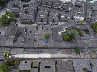 An aerial photo taken in Dujiangyan, China, on October 9, 2024, shows the ancient city complex of Guxian County in Dujiangyan City, Sichuan...