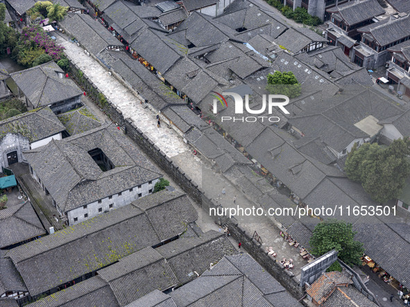 An aerial photo taken in Dujiangyan, China, on October 9, 2024, shows the ancient city complex of Guxian County in Dujiangyan City, Sichuan...